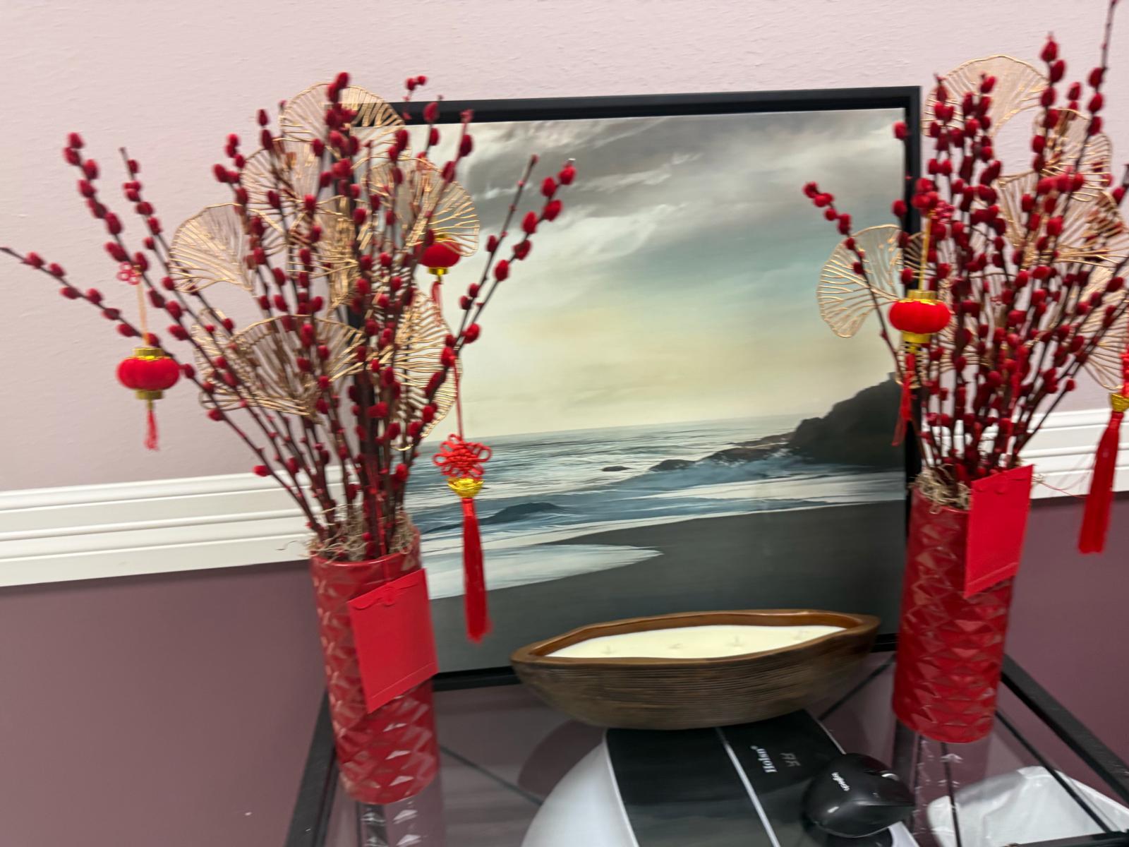 Waiting area at Rest and Beauty Spa with red floral arrangements